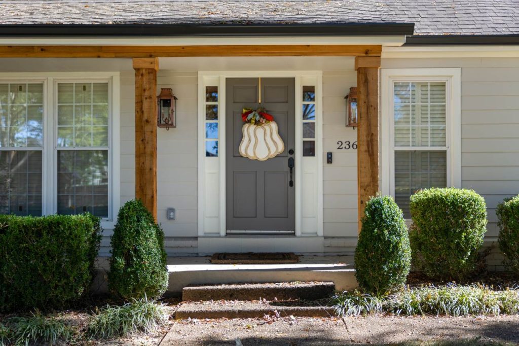 Grey entry door replaced on Memphis home by Bluff City Exteriors