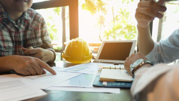 Asking a roofing contractor questions before signing a roofing contract.